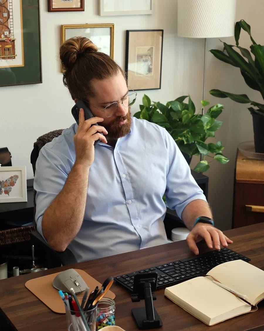 Nick Tidrick, founder of FnButton, on a call at his desk